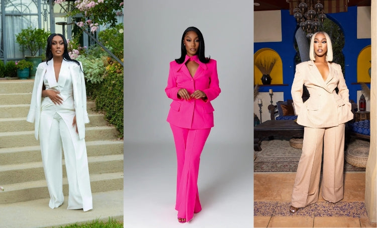 Three women modeling tailored wide-leg pantsuits: a white suit with draped blazer, a bold hot pink suit, and a beige suit with deep V-neck blazer.