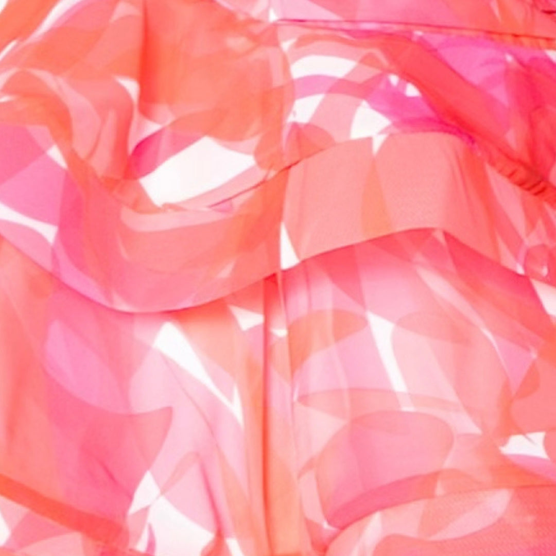 Close-up of a transparent pink and orange plastic bag with a floral pattern.