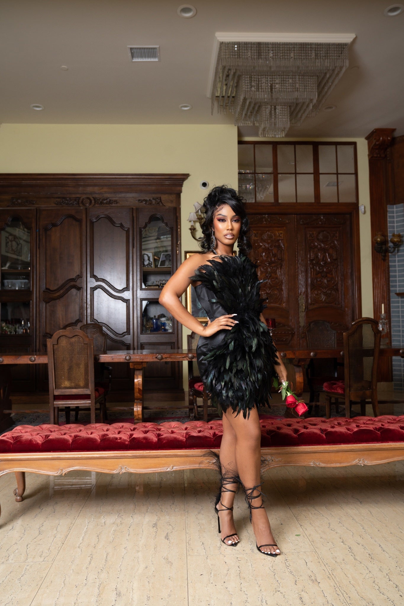 black dress with feathers crpe on the sleeves Be the center of attention in this long fitted black corset feather gown Laticia Dress With Feathers |